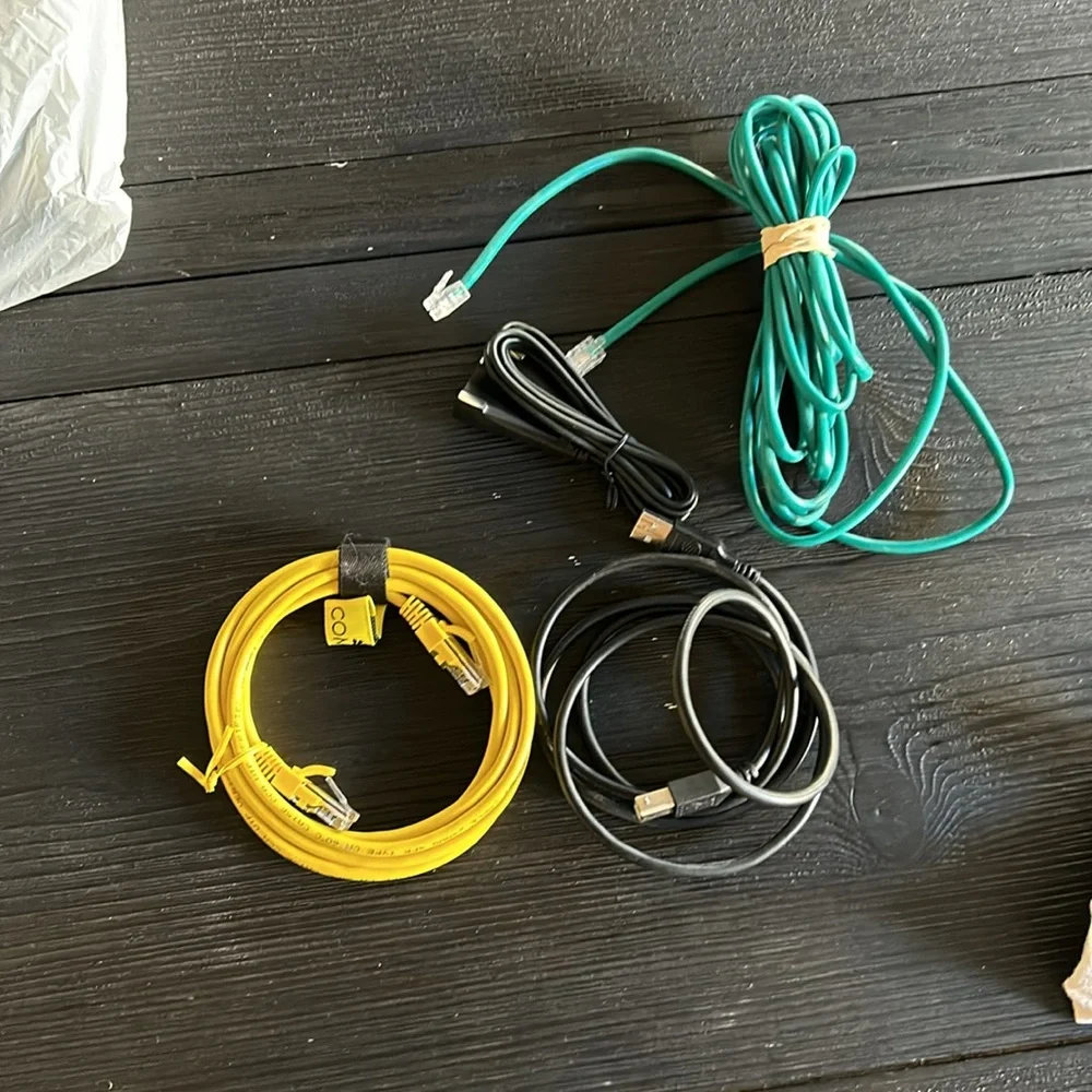 A lot of electronics cables, printer, ethernet